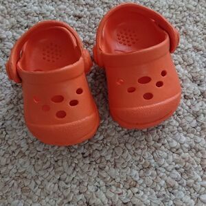 Cute orange color baby shoes